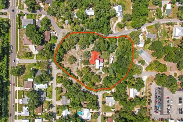 an aerial view of residential houses with yard