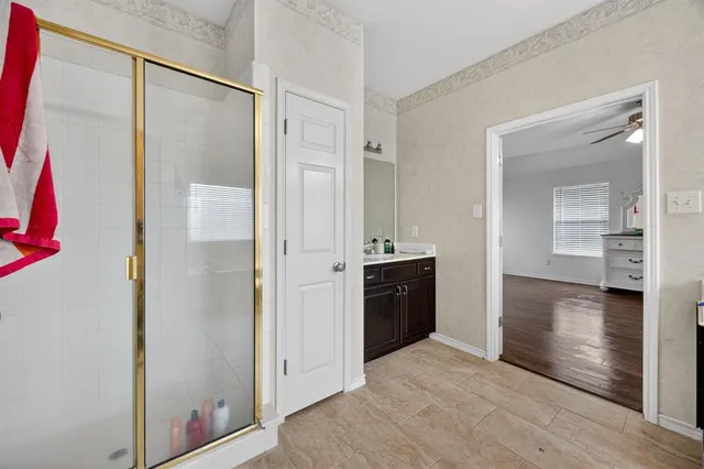 a view of a bathroom from a hallway