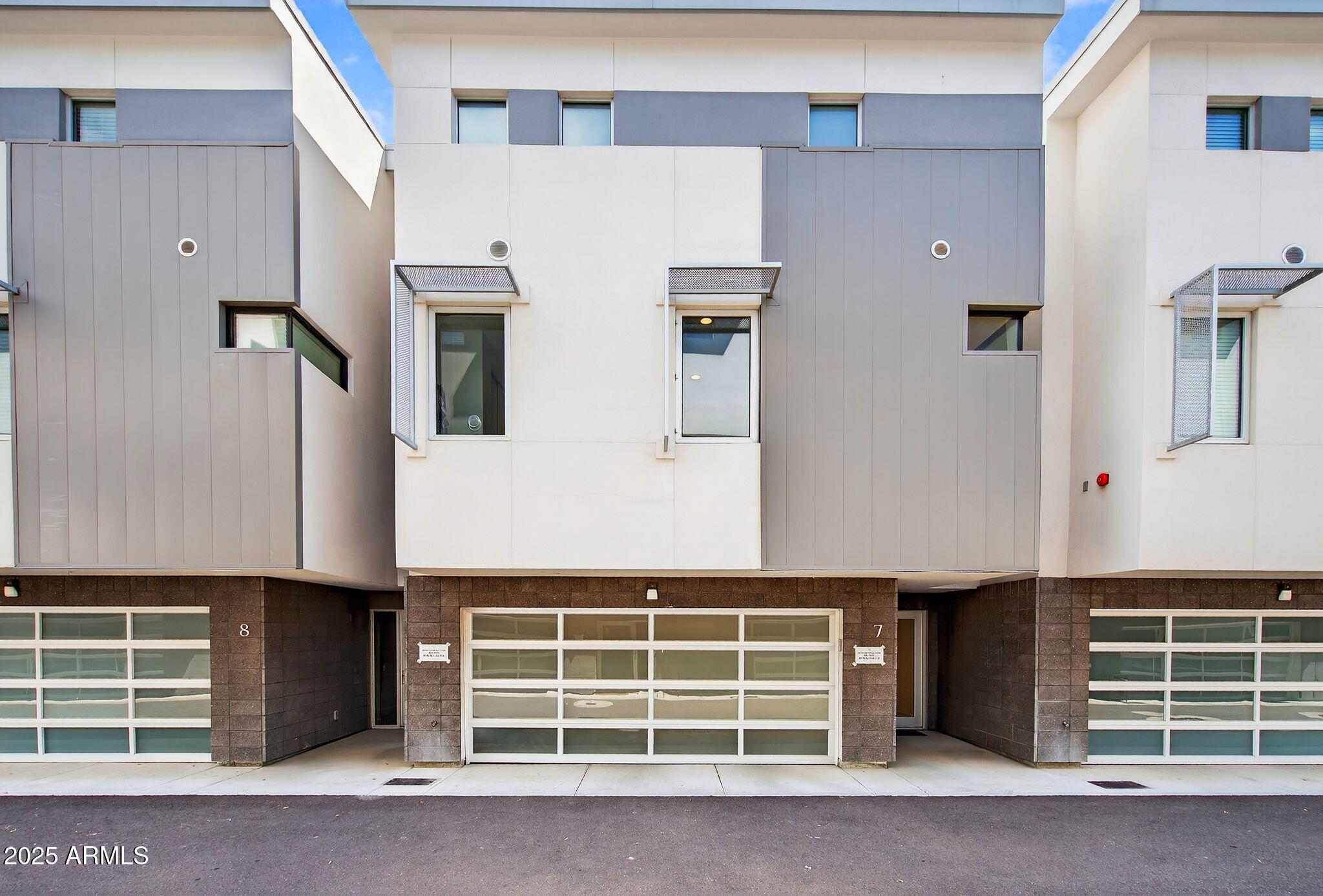 a front view of a building with windows