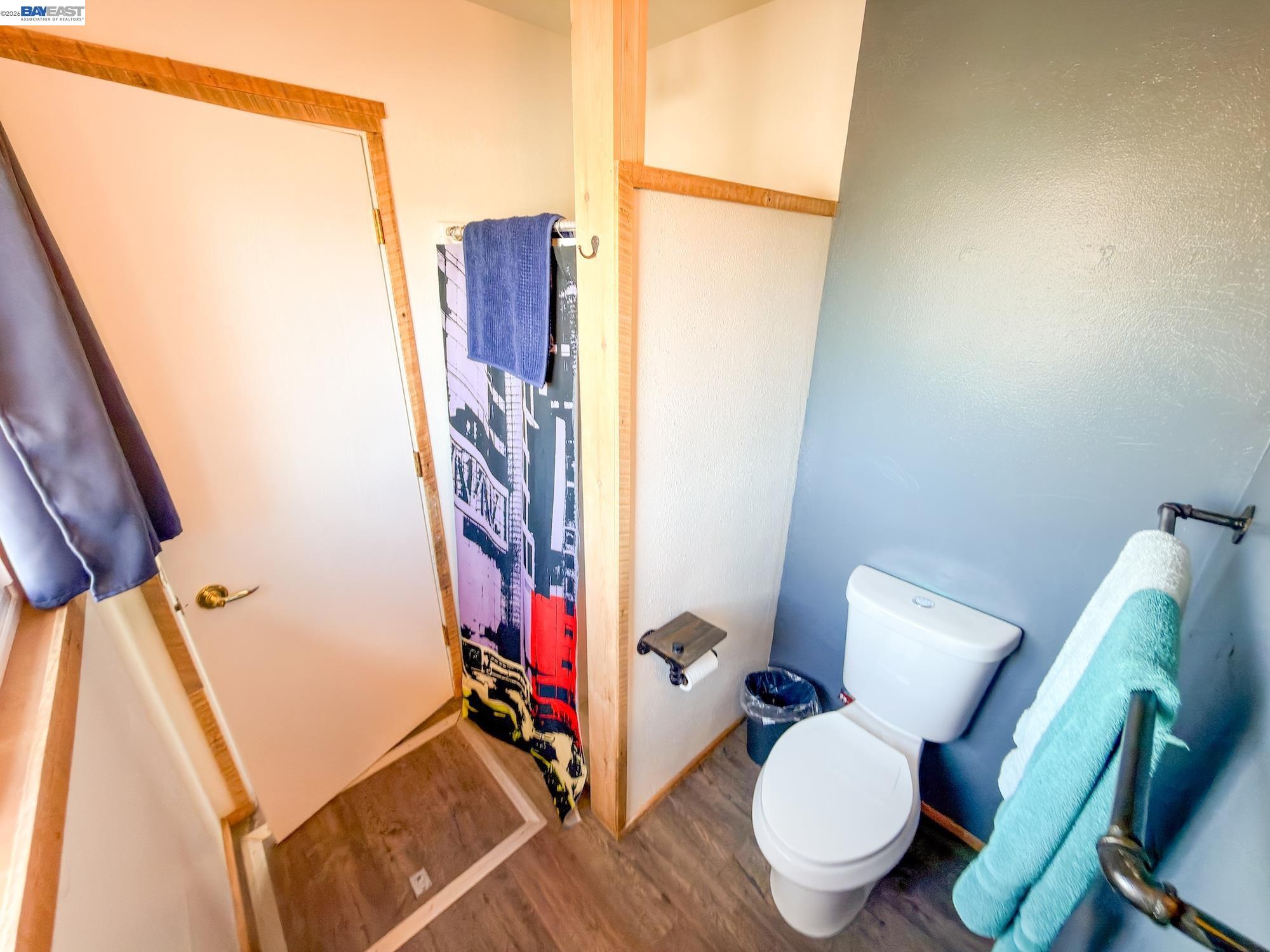609 East 7th Street Alturas, CA 96101 - Photo 13 of 21 a bathroom with a toilet and a mirror