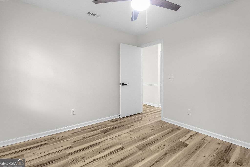 804 Ridgewood Way Hinesville, GA 31313 - Photo 12 of 27 wooden floor in an empty room