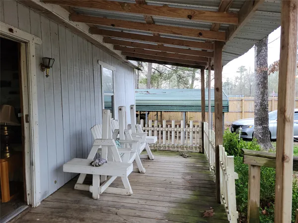 a view of outdoor space with wooden floor and outdoor seating