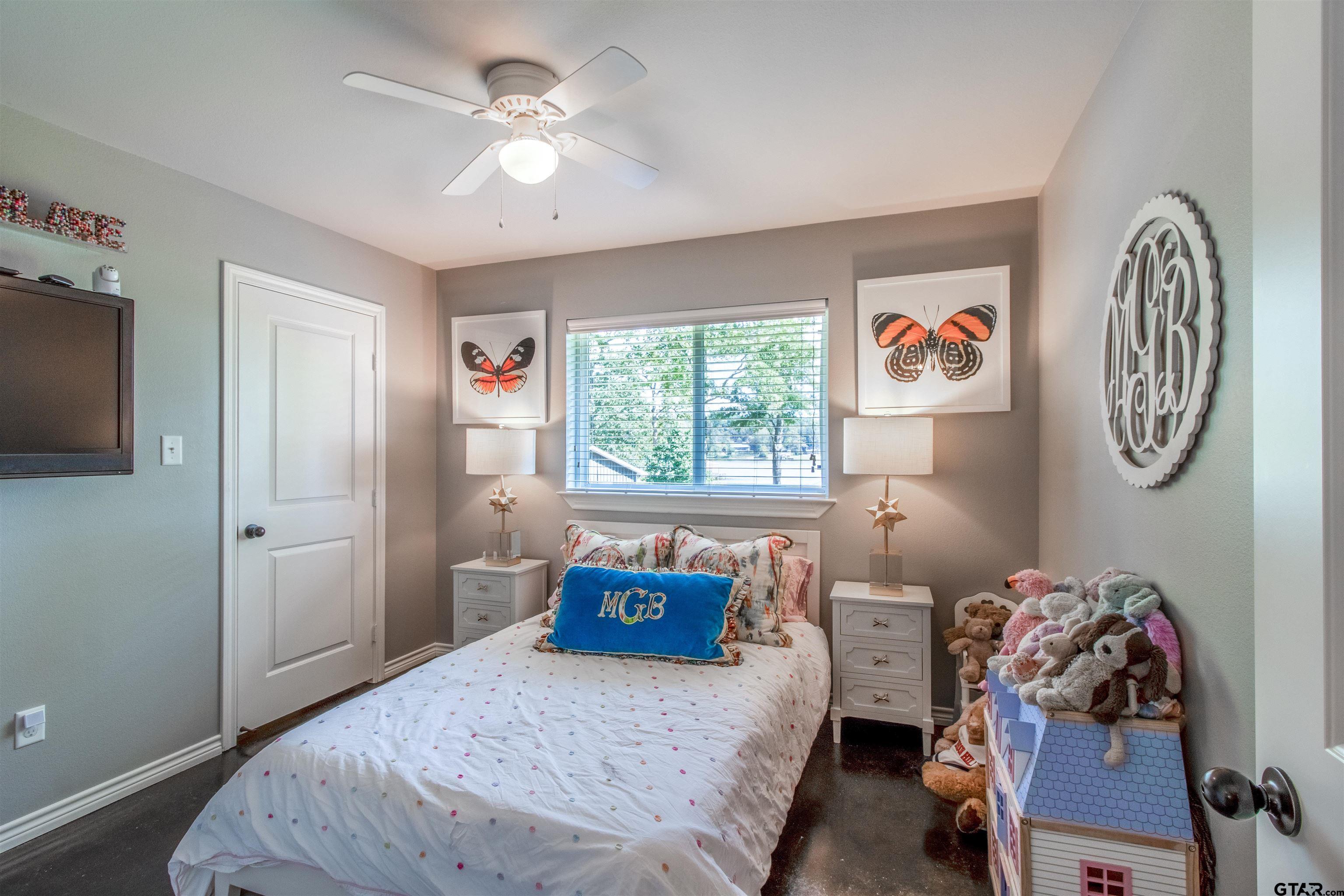 14271 NW Road Tyler, TX 75707 - Photo 20 of 48 a bedroom with a bed and a window