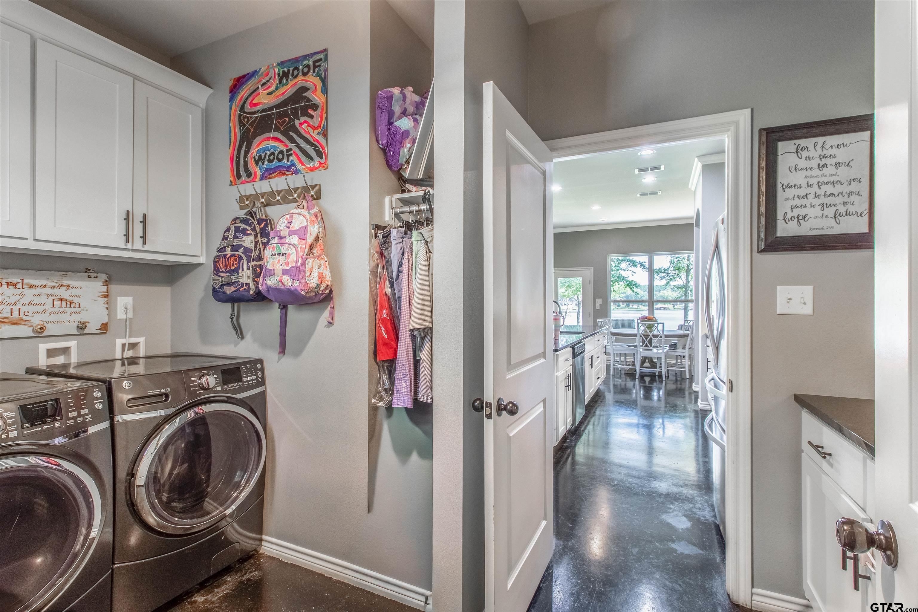14271 NW Road Tyler, TX 75707 - Photo 22 of 48 a view of a storage and utility room with washer and dryer