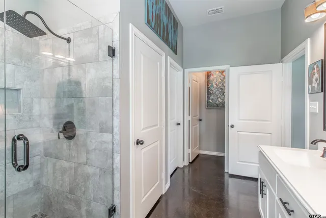 a bathroom with a sink and shower