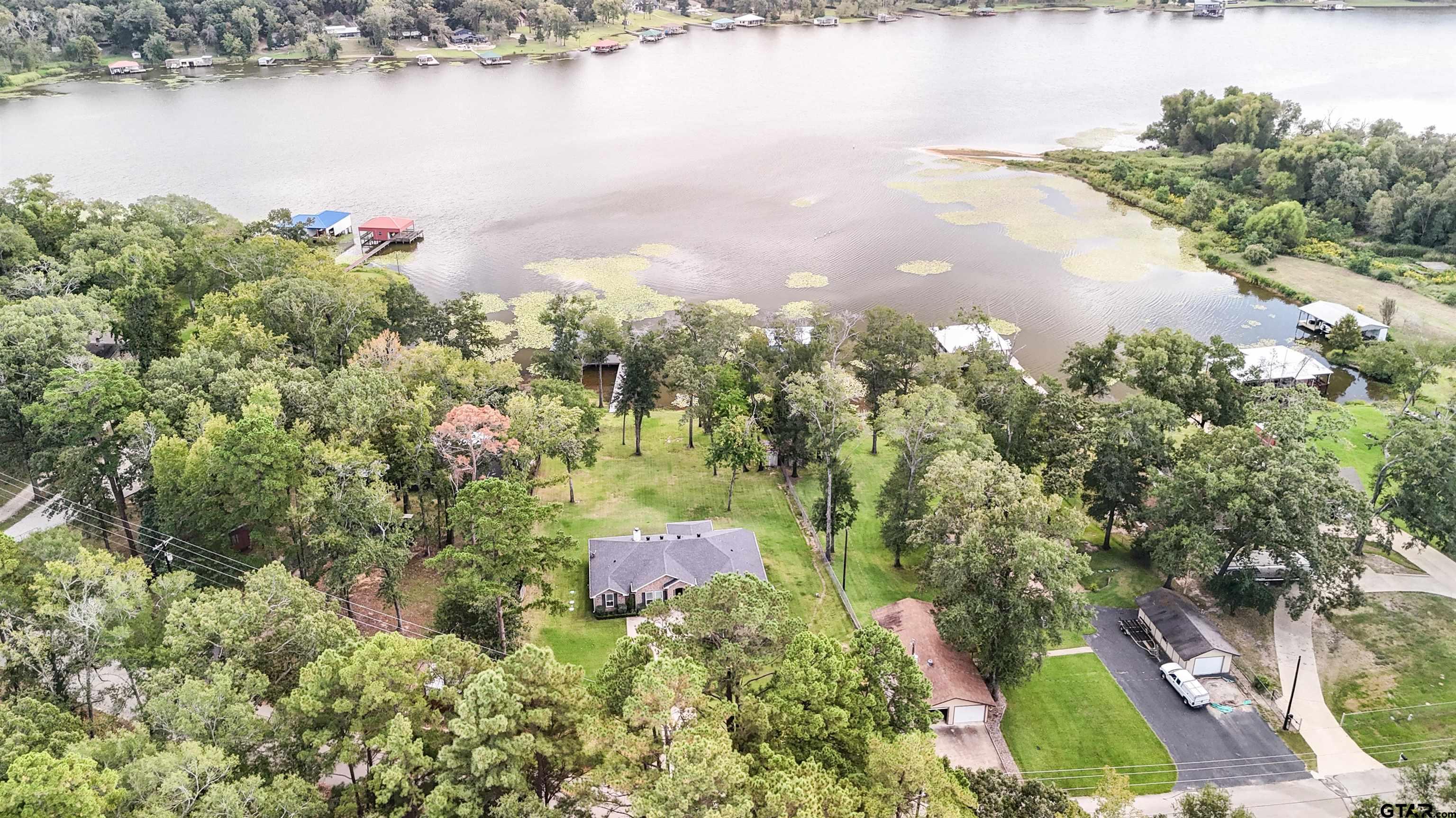 14271 NW Road Tyler, TX 75707 - Photo 34 of 48 an aerial view of lake and residential houses with outdoor space