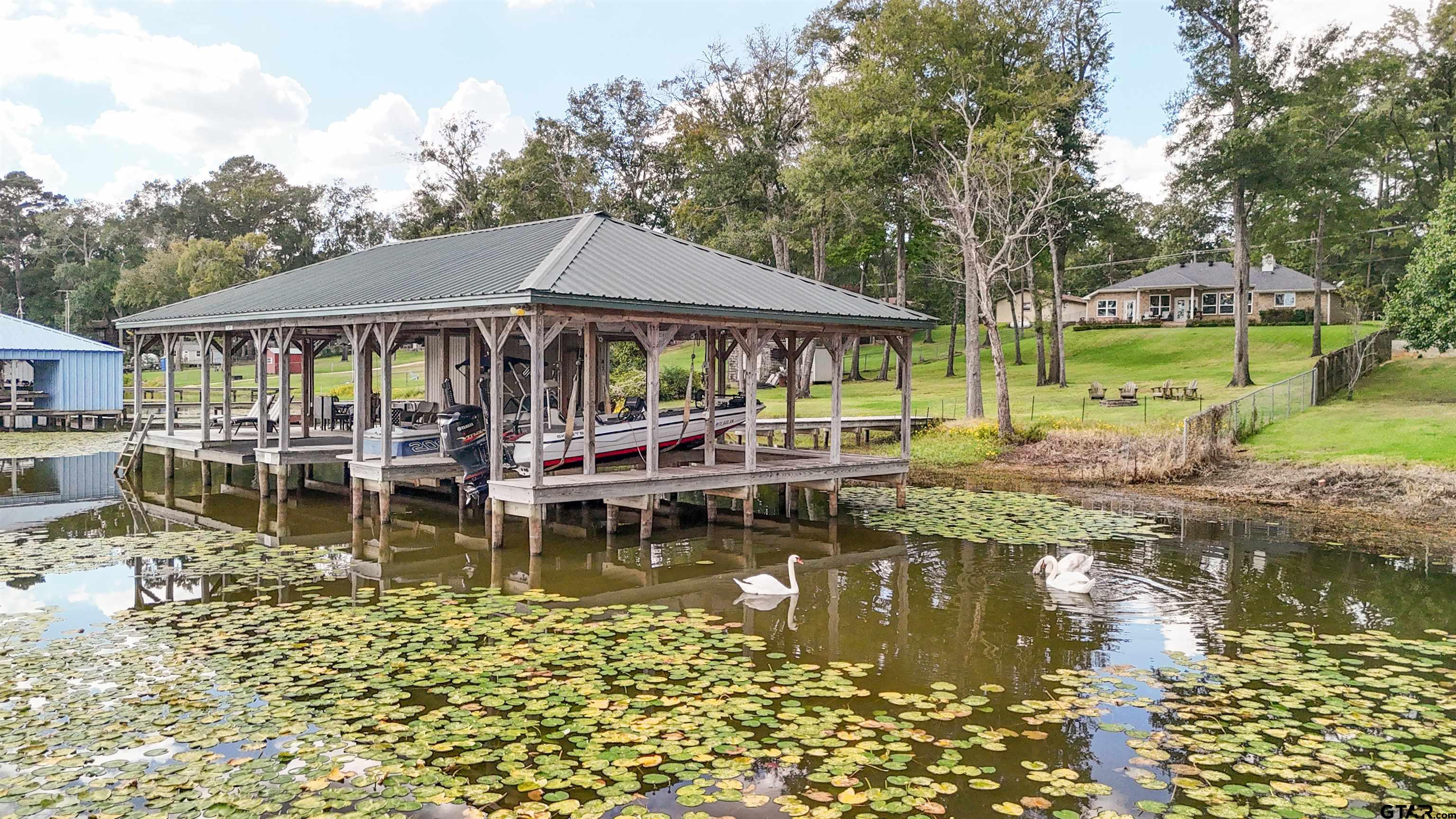 14271 NW Road Tyler, TX 75707 - Photo 35 of 48 a white house with yard and large trees