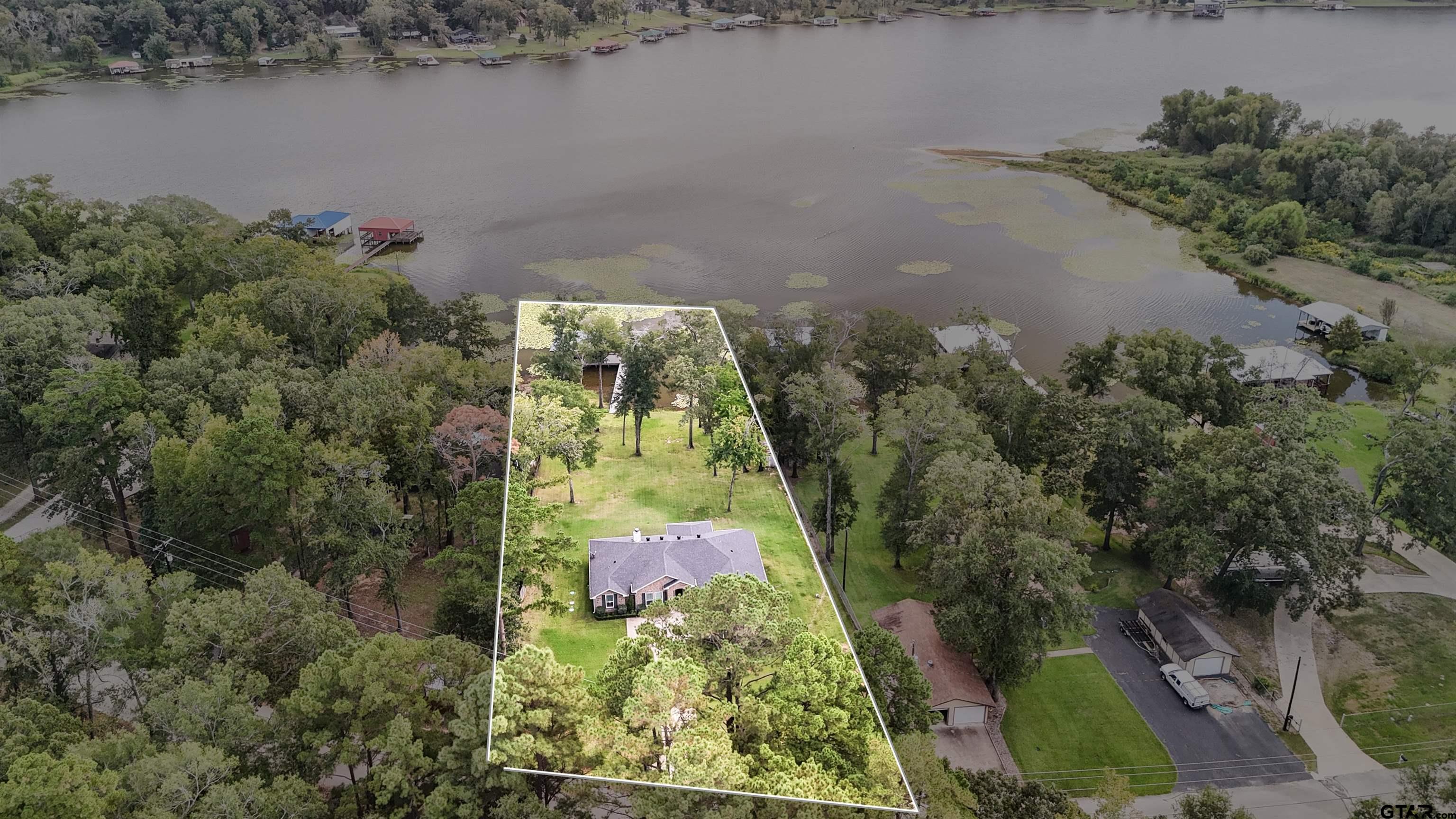 14271 NW Road Tyler, TX 75707 - Photo 44 of 48 an aerial view of residential house with outdoor space and lake view