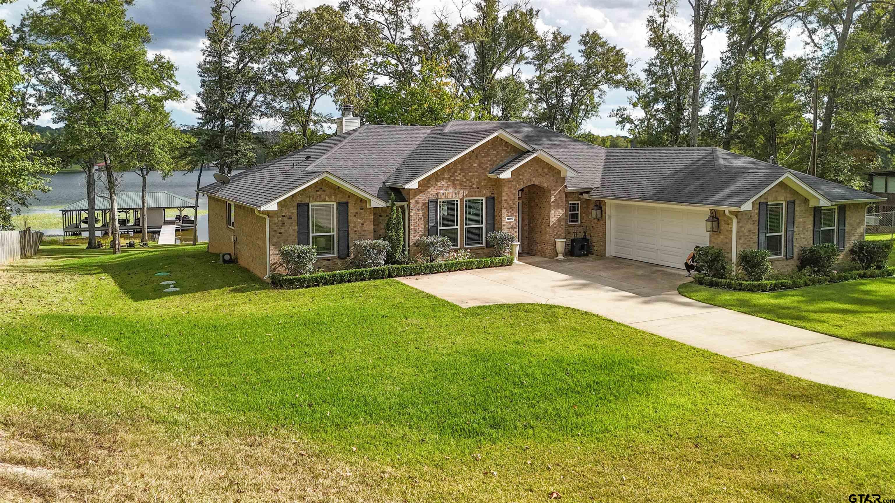 14271 NW Road Tyler, TX 75707 - Photo 45 of 48 a front view of a house with a yard