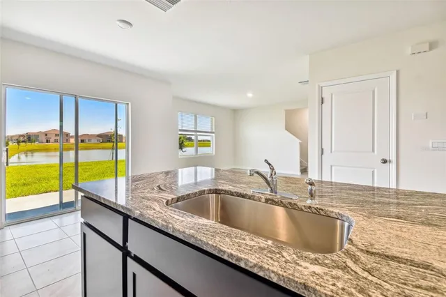 an empty room with floor to ceiling window