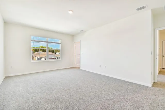 a bathroom with a granite countertop sink double and mirror