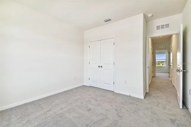 an aerial view of a house with a swimming pool outdoor seating and yard