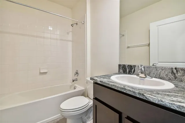 an aerial view of a swimming pool patio and lake view
