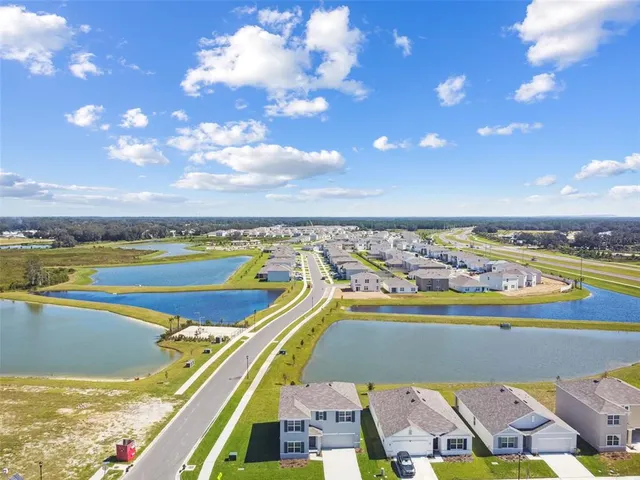 a view of a swimming pool with an outdoor space and seating