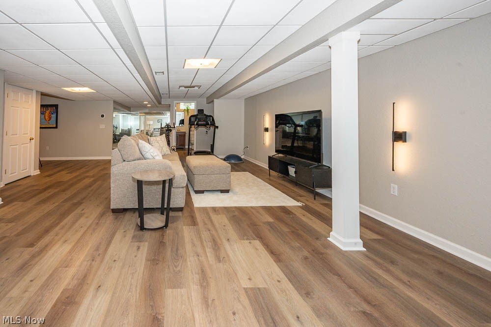 6787 South Palmyra Road Canfield, OH 44406 - Photo 22 of 30 Finished basement space featuring wood-finish flooring, recessed lighting, and wall-mounted sconces