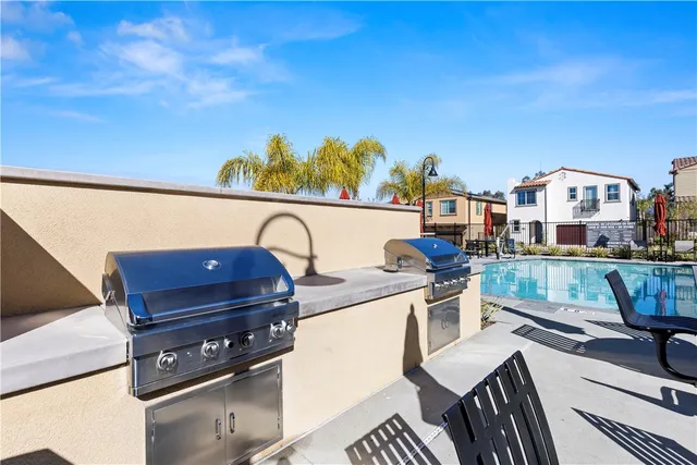 a view of a swimming pool with outdoor seating