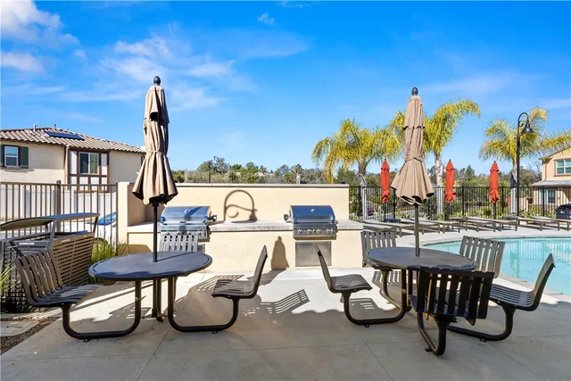 a view of a chairs and table in the patio