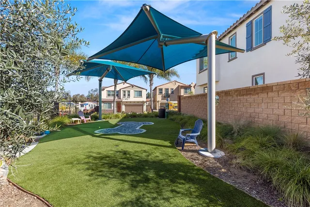 a small house with a tree in the background