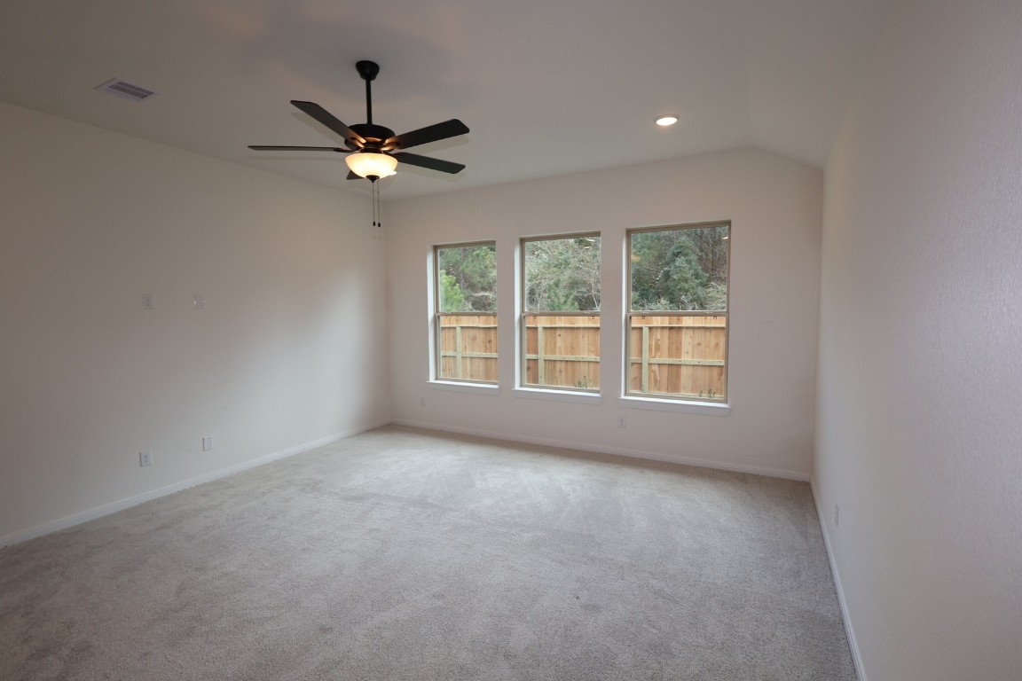 42623 Rustico Road Magnolia, TX 77354 - Photo 10 of 17 a view of a livingroom with a ceiling fan and window