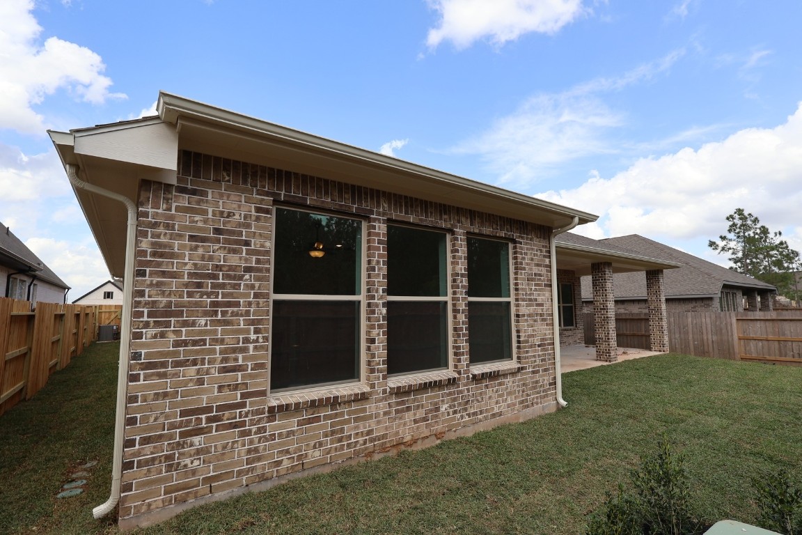 42623 Rustico Road Magnolia, TX 77354 - Photo 2 of 17 a front view of a house with a garden