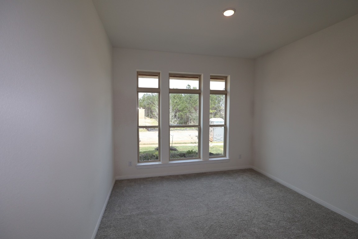 42623 Rustico Road Magnolia, TX 77354 - Photo 6 of 17 an empty room with windows