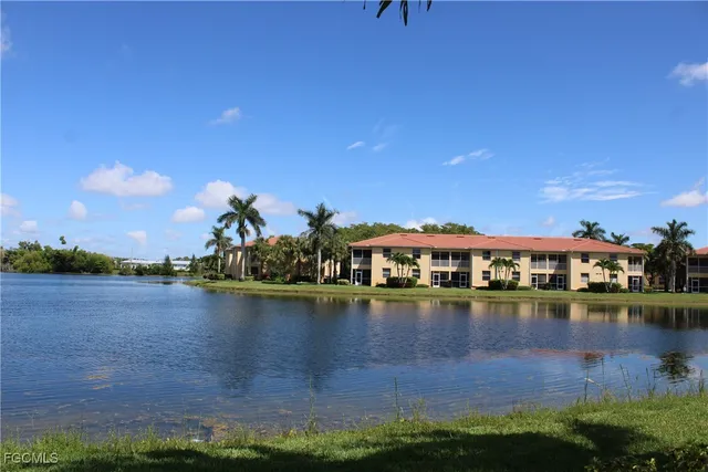 a view of a lake with a building in the background