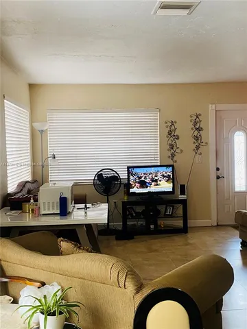 a kitchen with a sink cabinets and appliances