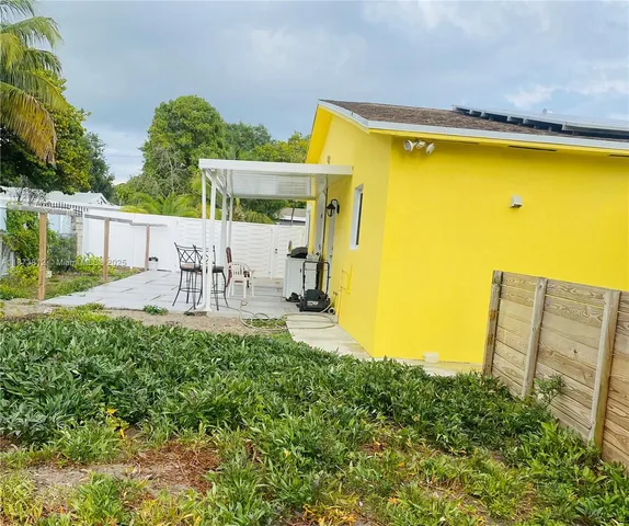 a view of a large pool with an outdoor space