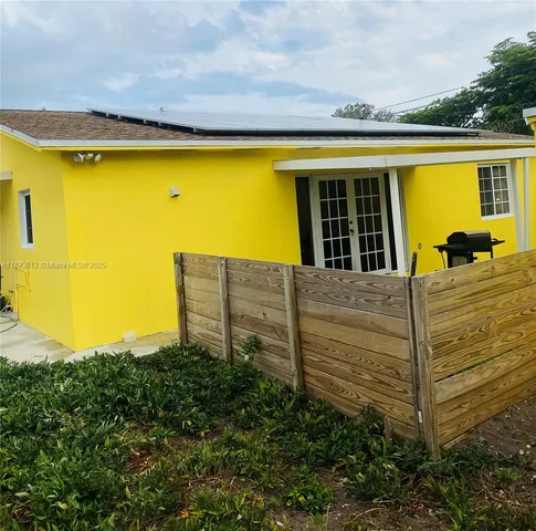 a view of a swimming pool with a yard