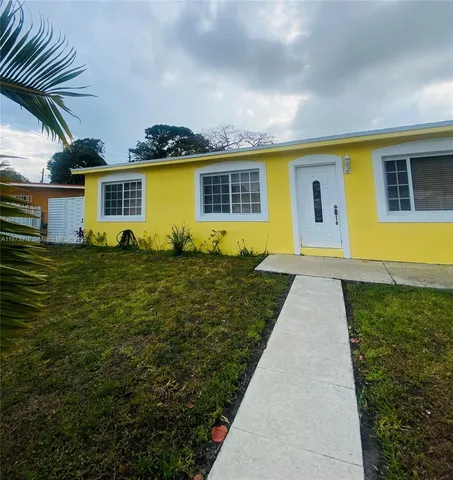 a kitchen with a sink cabinets and appliances