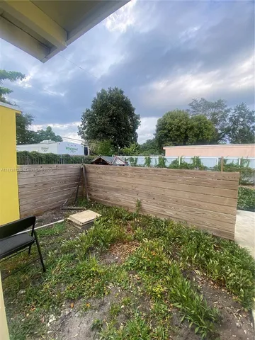 a bathroom with a sink toilet and a mirror