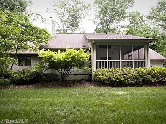 4102 Rockingham Road South Greensboro, NC 27407 - Photo 15 of 16 Exterior Back. Private, peaceful backyard awaits you - make this your home today!