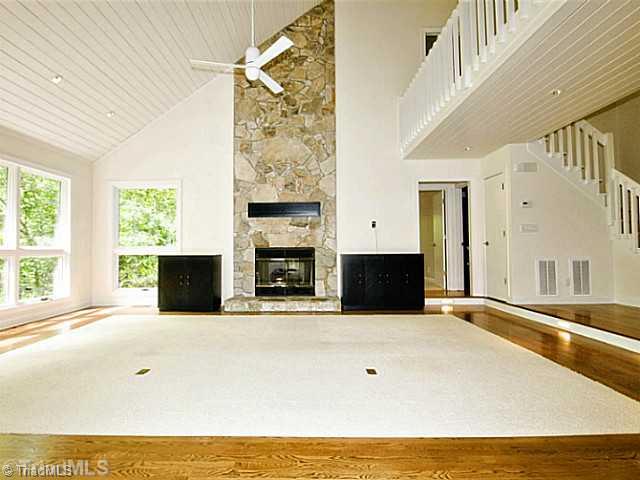 4102 Rockingham Road South Greensboro, NC 27407 - Photo 3 of 16 Living Room. Living Room includes gas log fireplace, Karastan wool carpet, hardwoods, large windows, and more.