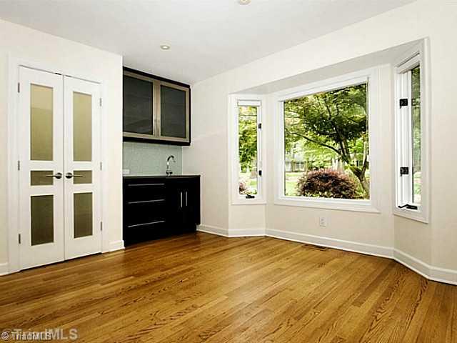 4102 Rockingham Road South Greensboro, NC 27407 - Photo 6 of 16 Breakfast. Breakfast area by bay window overlooks gorgeous landscaping in front yard. Walk-in pantry & wet bar w/sink are just more fantastic amenities in this home.