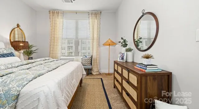 a bedroom with bed and a window