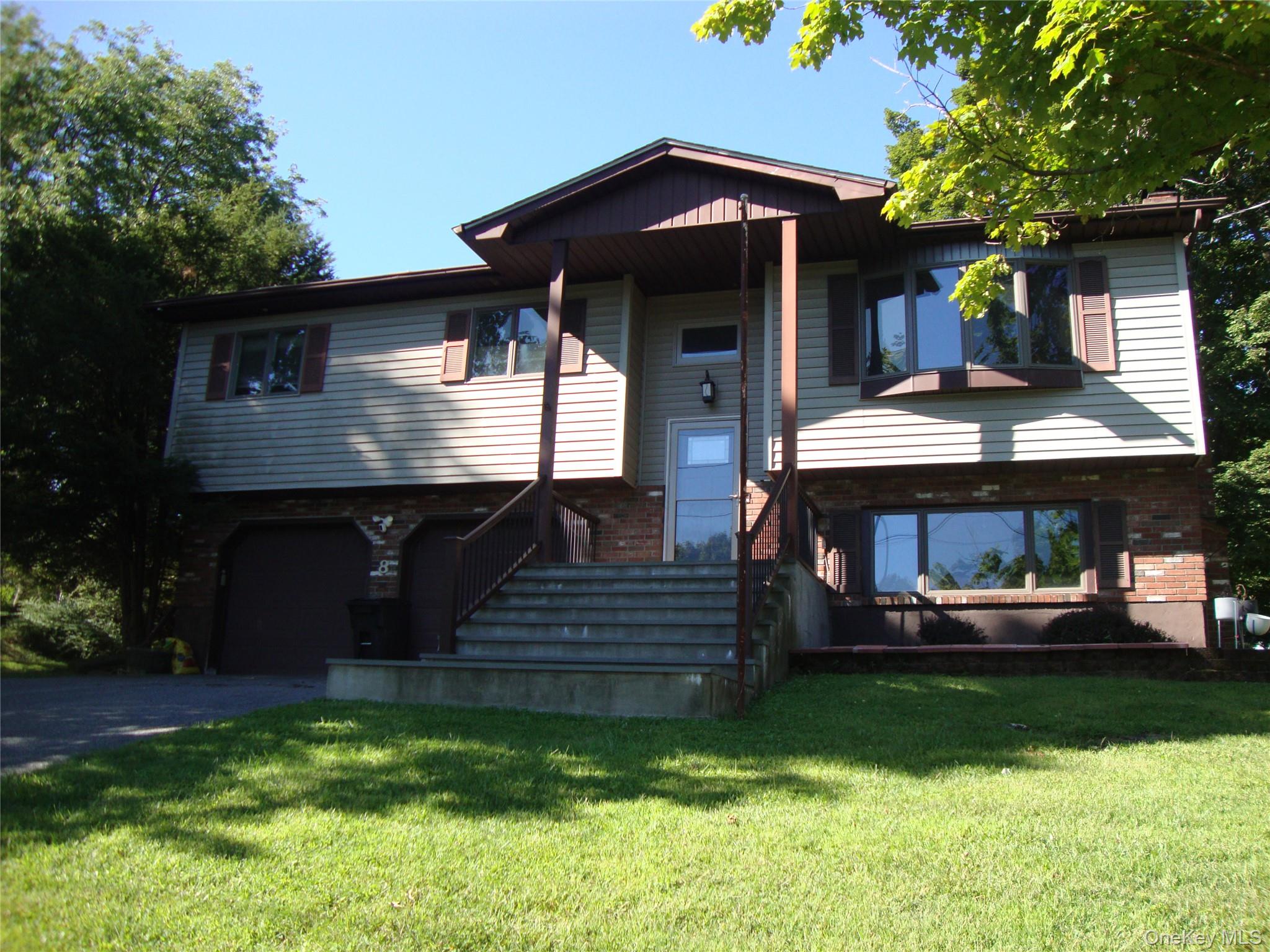8 O Sullivan Lane Monroe, NY 10950 - Photo 1 of 1 a front view of a house with a yard