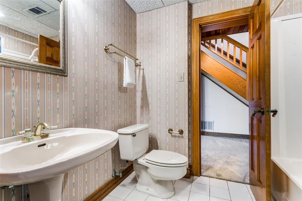 1557 Latigo Hills Road Bartonville, TX 75022 - Photo 27 of 40 Half bathroom with light tile patterned floors and wallpapered walls