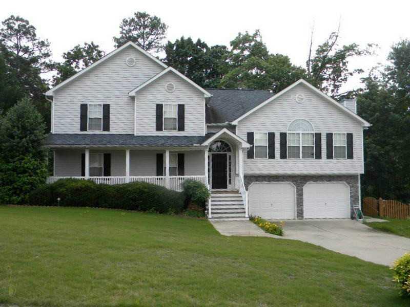 407 Maple Ridge White, GA 30184 - Photo 1 of 1 Exterior Front. Beautifully maintained stone accent home boasts rocking chair front porch & two car garage!