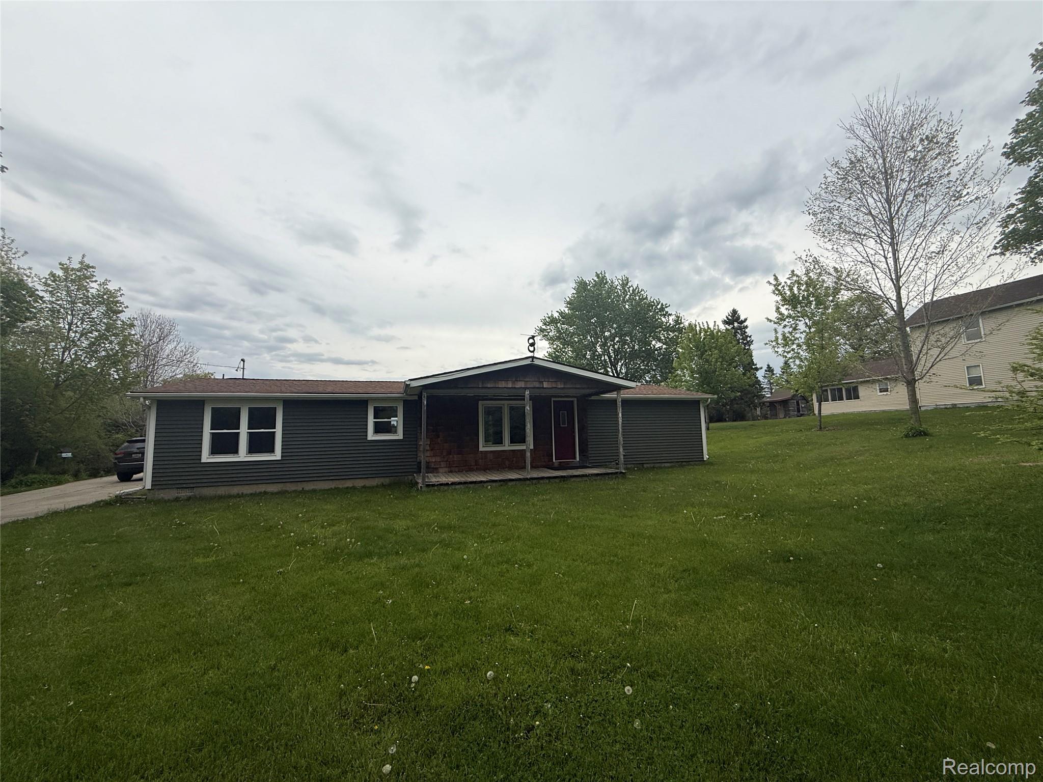 7149-7163 Burpee Road Grand Blanc, MI 48439 - Photo 32 of 72 Back of property with a lawn