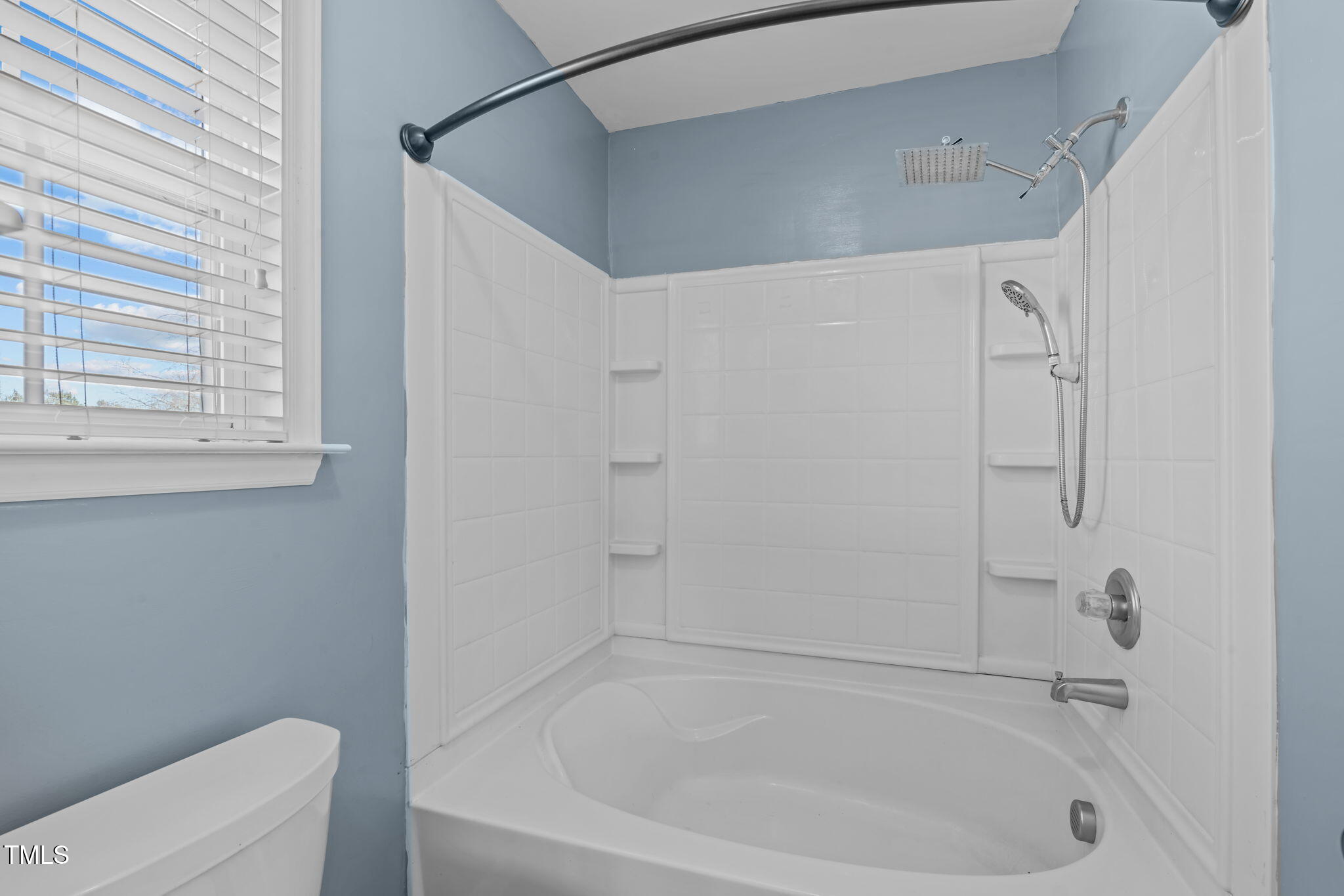 7905 Willow Croft Drive Willow Spring, NC 27592 - Photo 11 of 26 a close up of a bathtub curtain