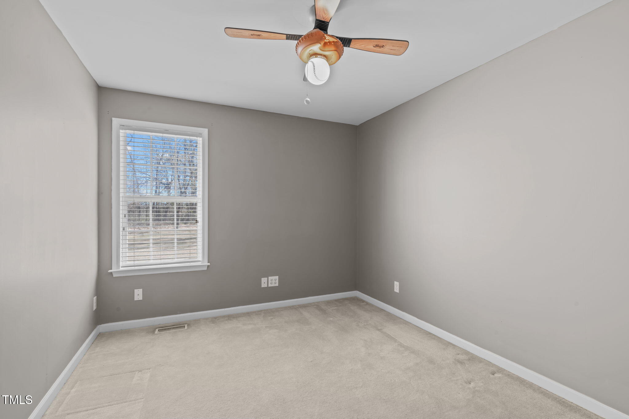 7905 Willow Croft Drive Willow Spring, NC 27592 - Photo 14 of 26 an empty room with windows and fan
