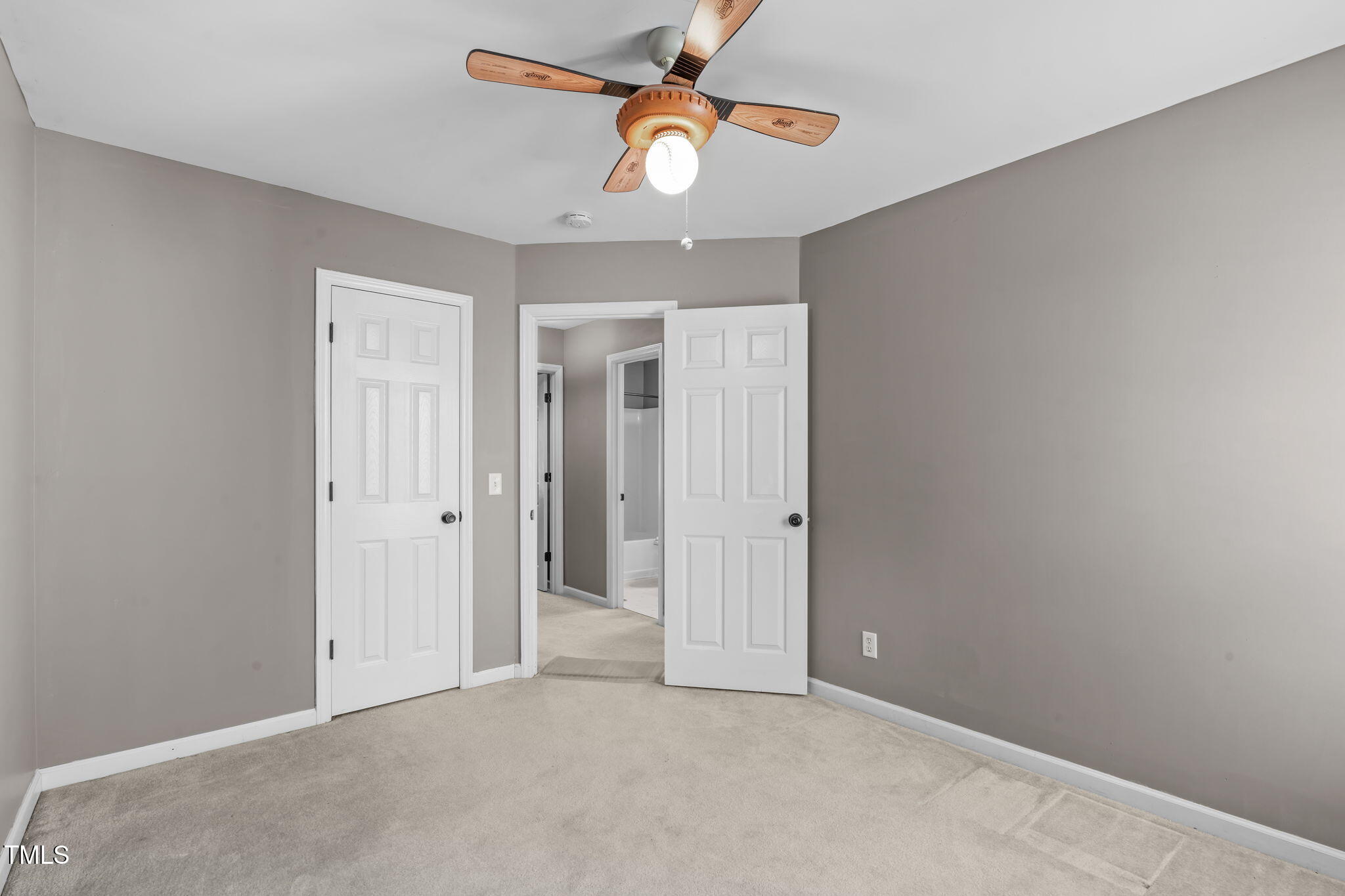 7905 Willow Croft Drive Willow Spring, NC 27592 - Photo 15 of 26 an empty room with closet and a chandelier fan