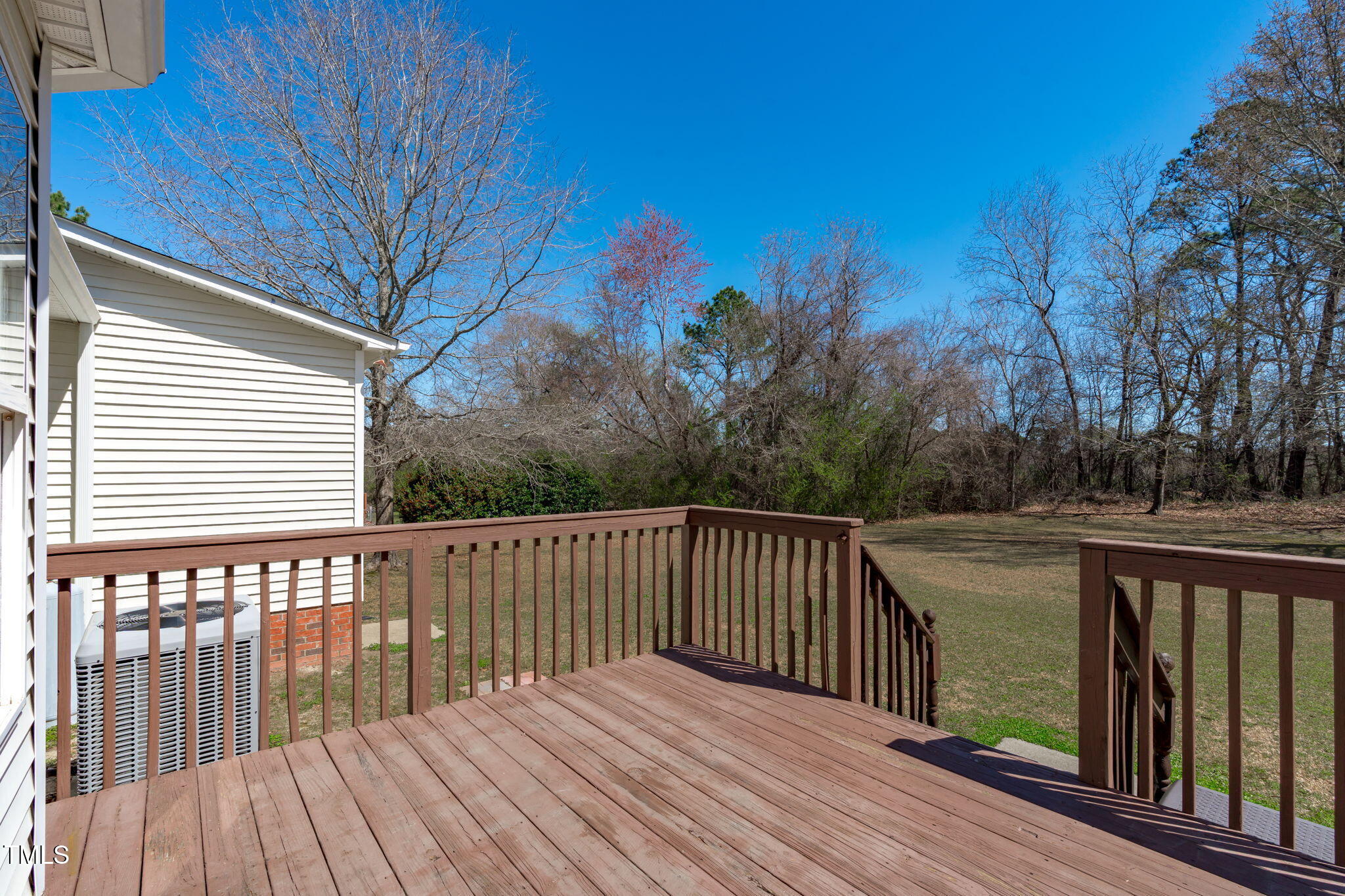 7905 Willow Croft Drive Willow Spring, NC 27592 - Photo 17 of 26 a balcony with wooden floor and fence