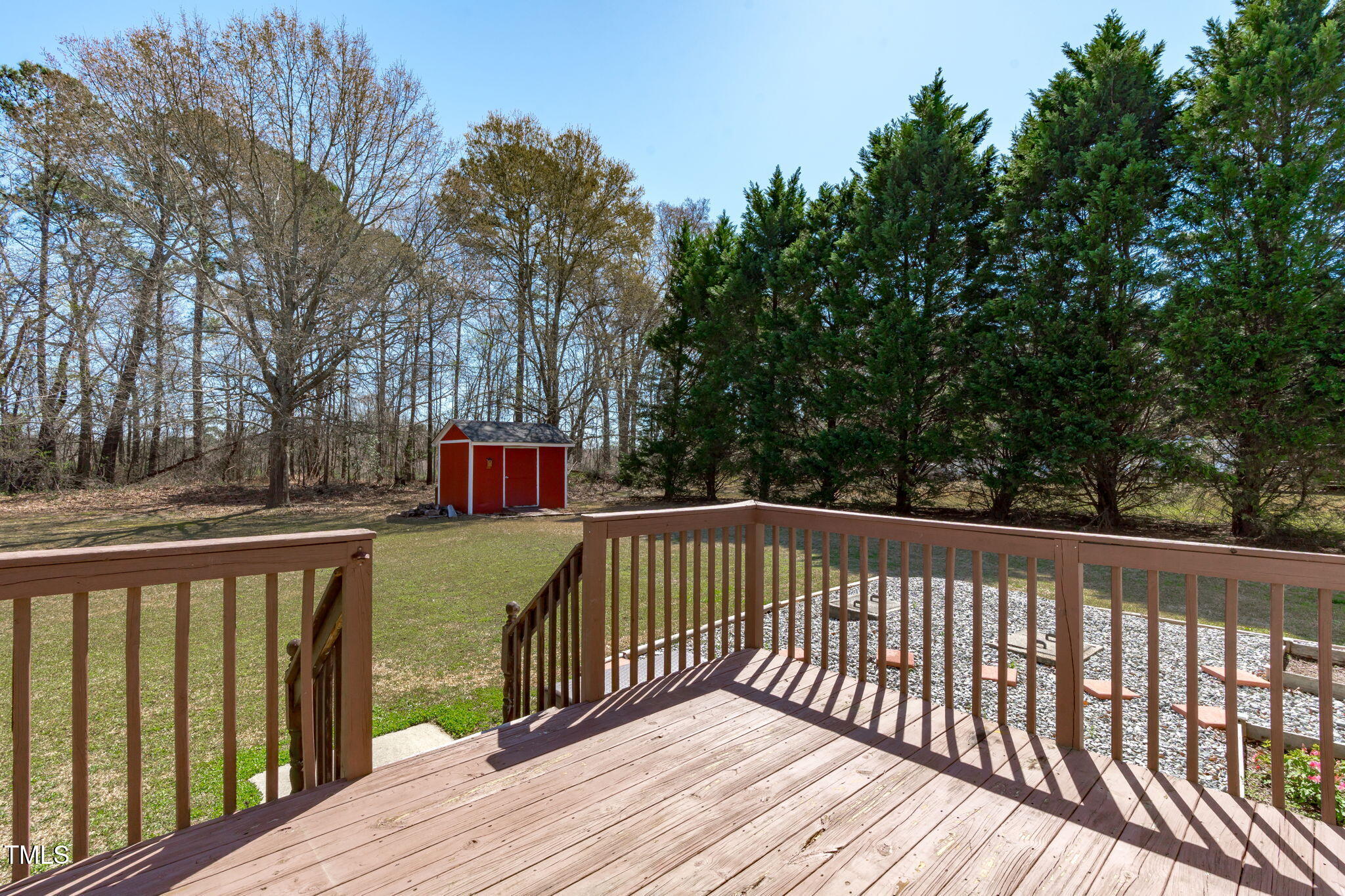 7905 Willow Croft Drive Willow Spring, NC 27592 - Photo 18 of 26 a view of wooden deck and a garden
