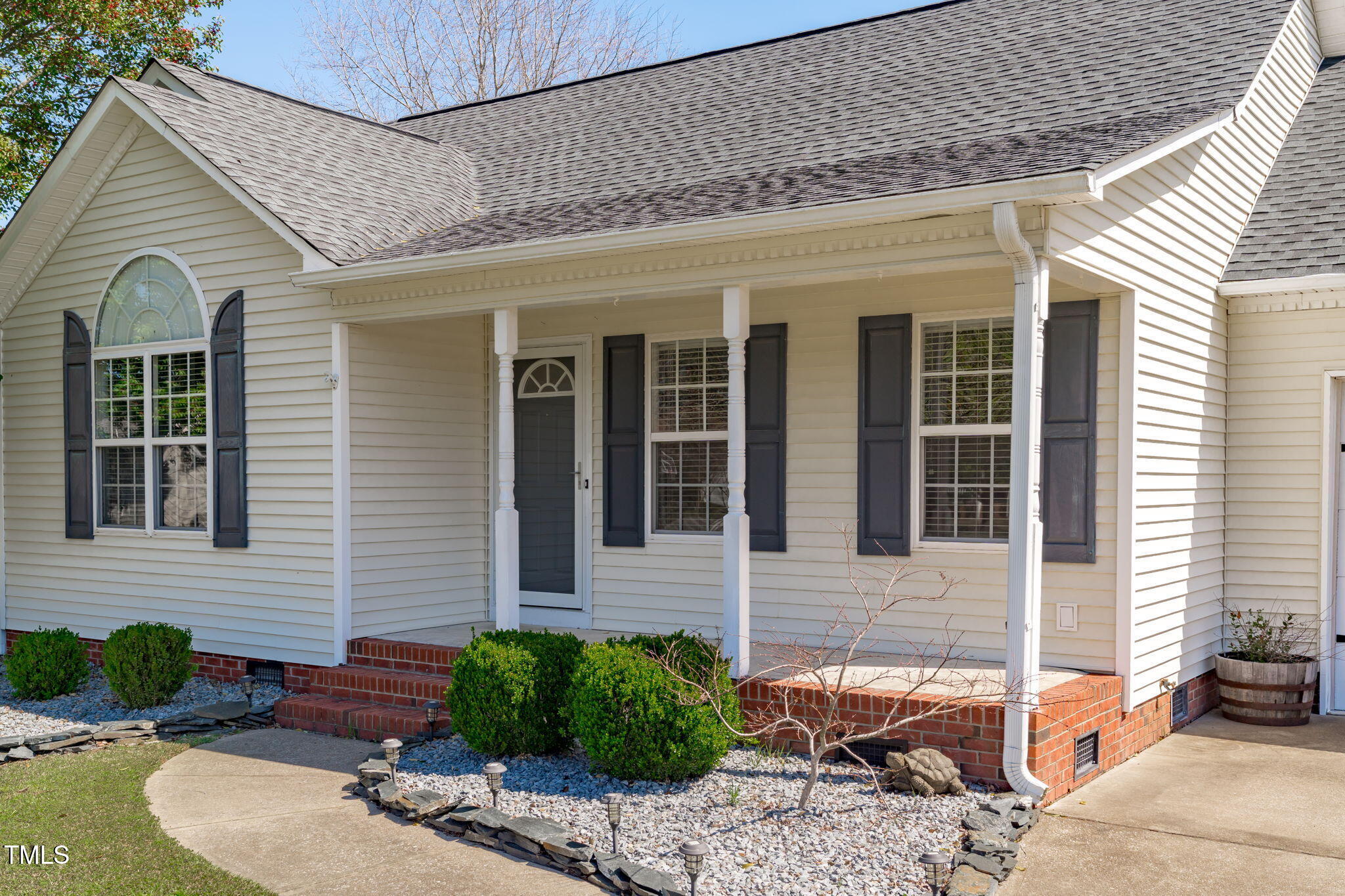 7905 Willow Croft Drive Willow Spring, NC 27592 - Photo 2 of 26 a view of a house with a yard and sitting space