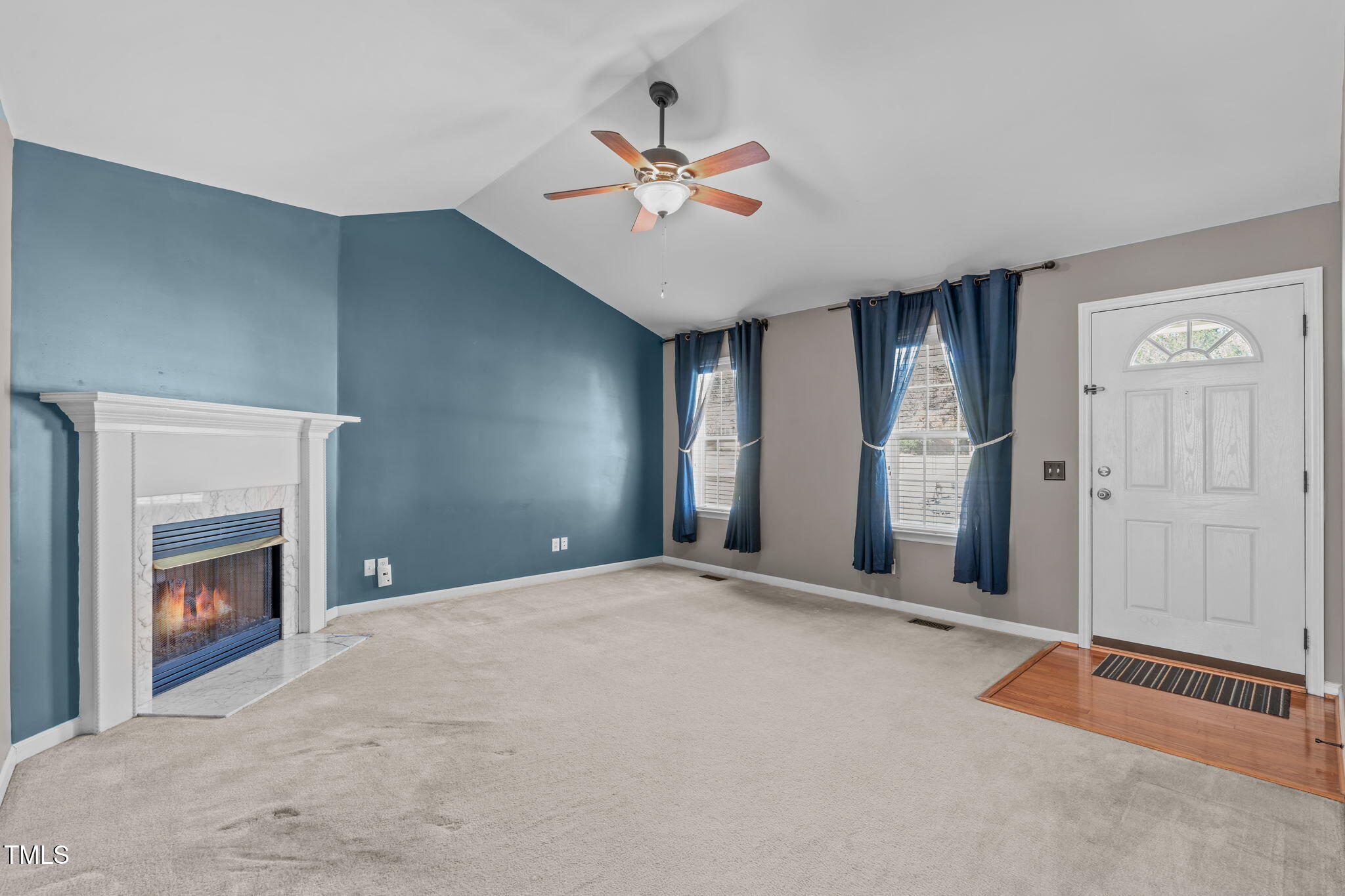 7905 Willow Croft Drive Willow Spring, NC 27592 - Photo 3 of 26 a view of an empty room with closet and a fireplace