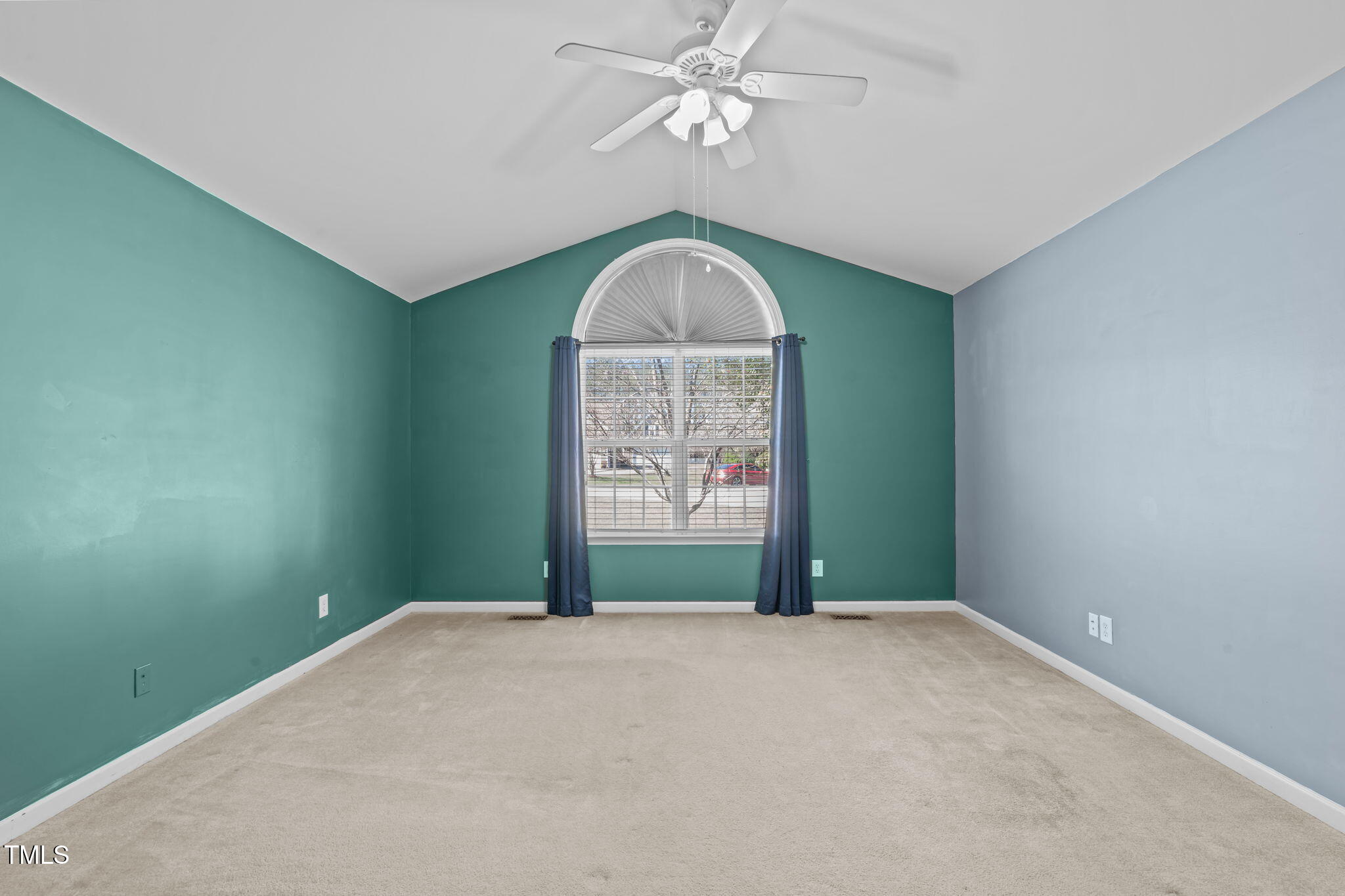 7905 Willow Croft Drive Willow Spring, NC 27592 - Photo 8 of 26 an empty room with windows and fan