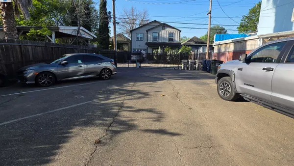 a view of a car parked in front of a house