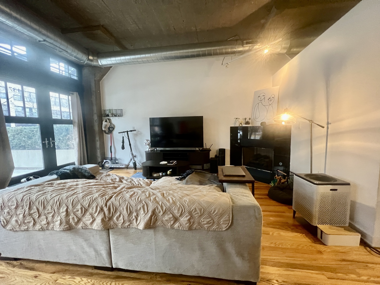 1151 West 15th Street, Unit 137 Chicago, IL 60608 - Photo 11 of 27 a bedroom with a bed and flat screen tv