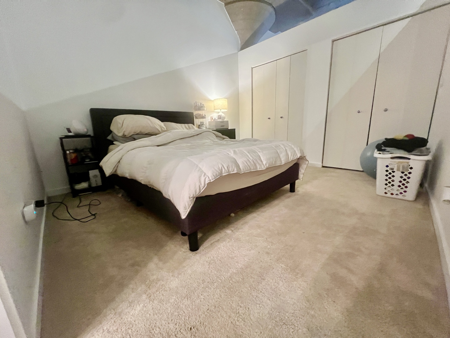 1151 West 15th Street, Unit 137 Chicago, IL 60608 - Photo 13 of 27 a bedroom with a bed and a table